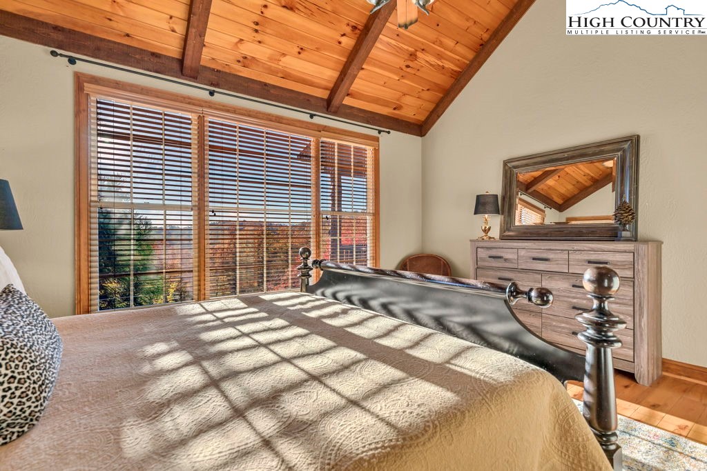 3664 Elk Ridge Road Ferguson, NC 28624 - Photo 26 of 46 a bedroom with a bed and a flat screen tv