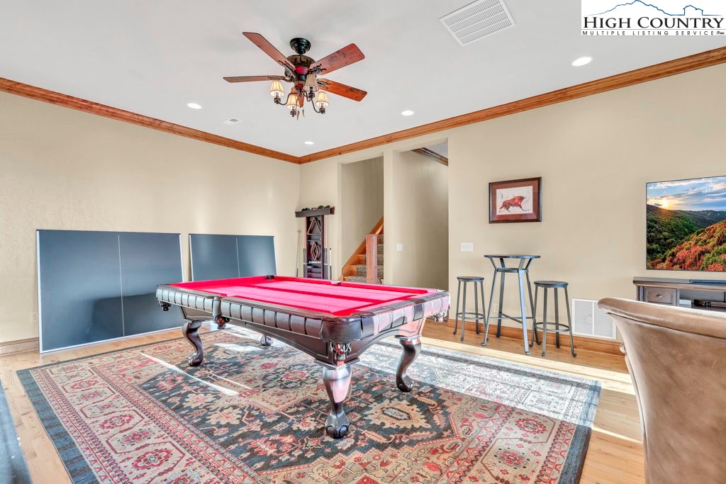 3664 Elk Ridge Road Ferguson, NC 28624 - Photo 31 of 46 a room with a table and a chandelier