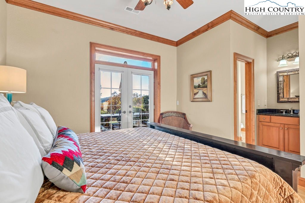 3664 Elk Ridge Road Ferguson, NC 28624 - Photo 34 of 46 a bedroom with a bed and a large window