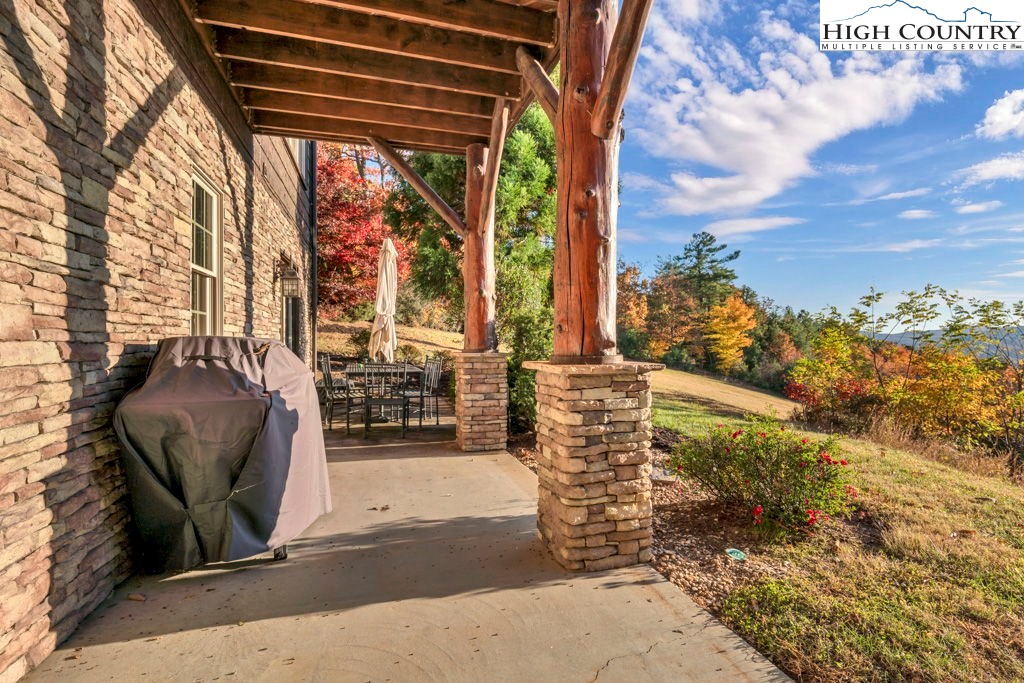 3664 Elk Ridge Road Ferguson, NC 28624 - Photo 40 of 46 a view of roof deck with chair and tables