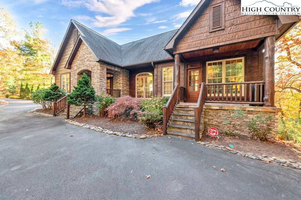 3664 Elk Ridge Road Ferguson, NC 28624 - Photo 4 of 46 a front view of a house with garden