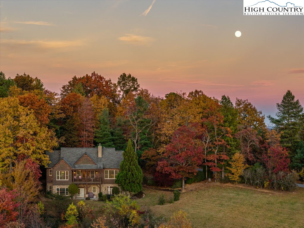 3664 Elk Ridge Road Ferguson, NC 28624 - Photo 41 of 46 an aerial view of a house with a yard and mountain view in back
