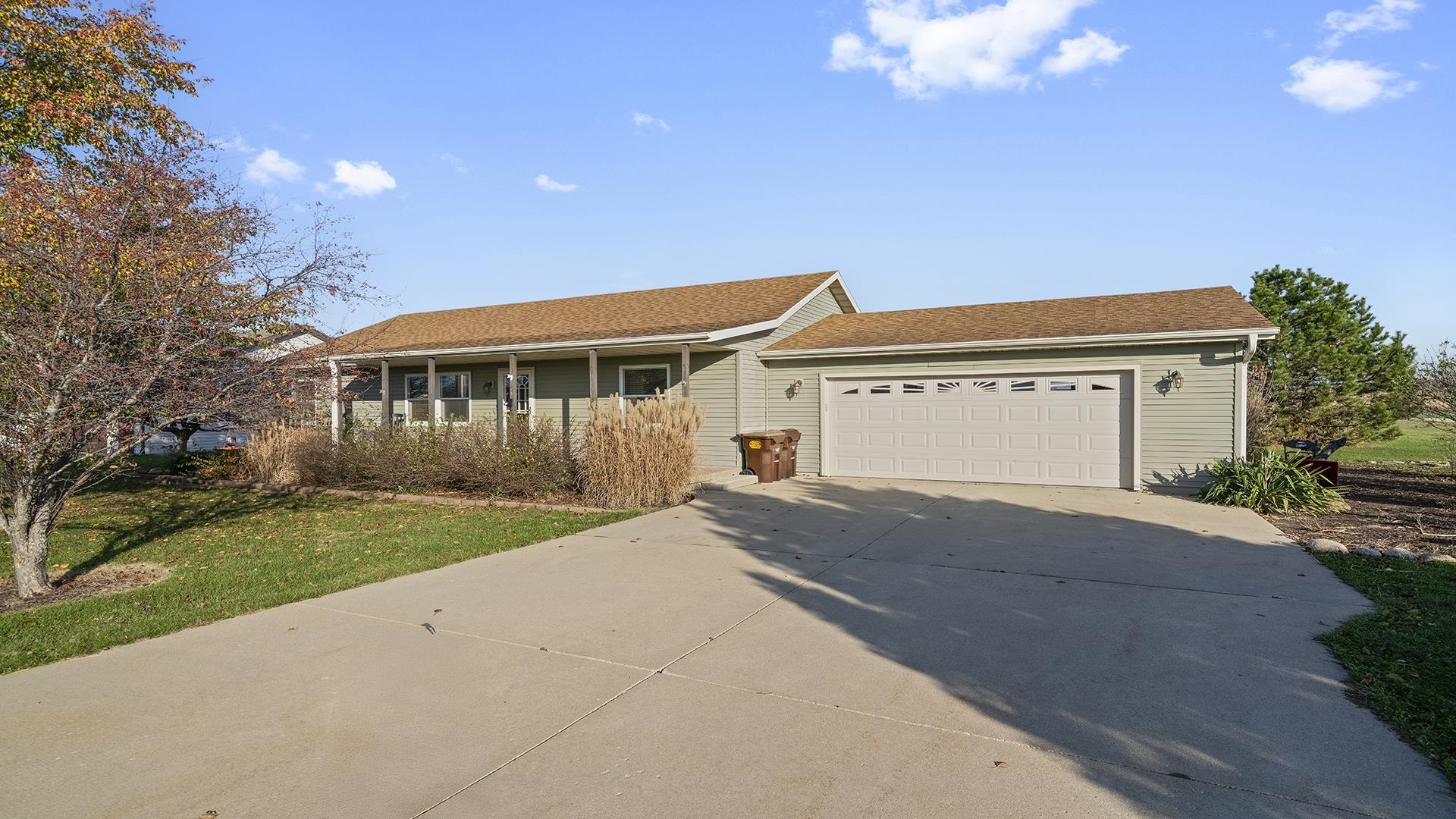 6749 Friday Road Byron, IL 61010 - Photo 1 of 36 a view of a house with a yard and garage