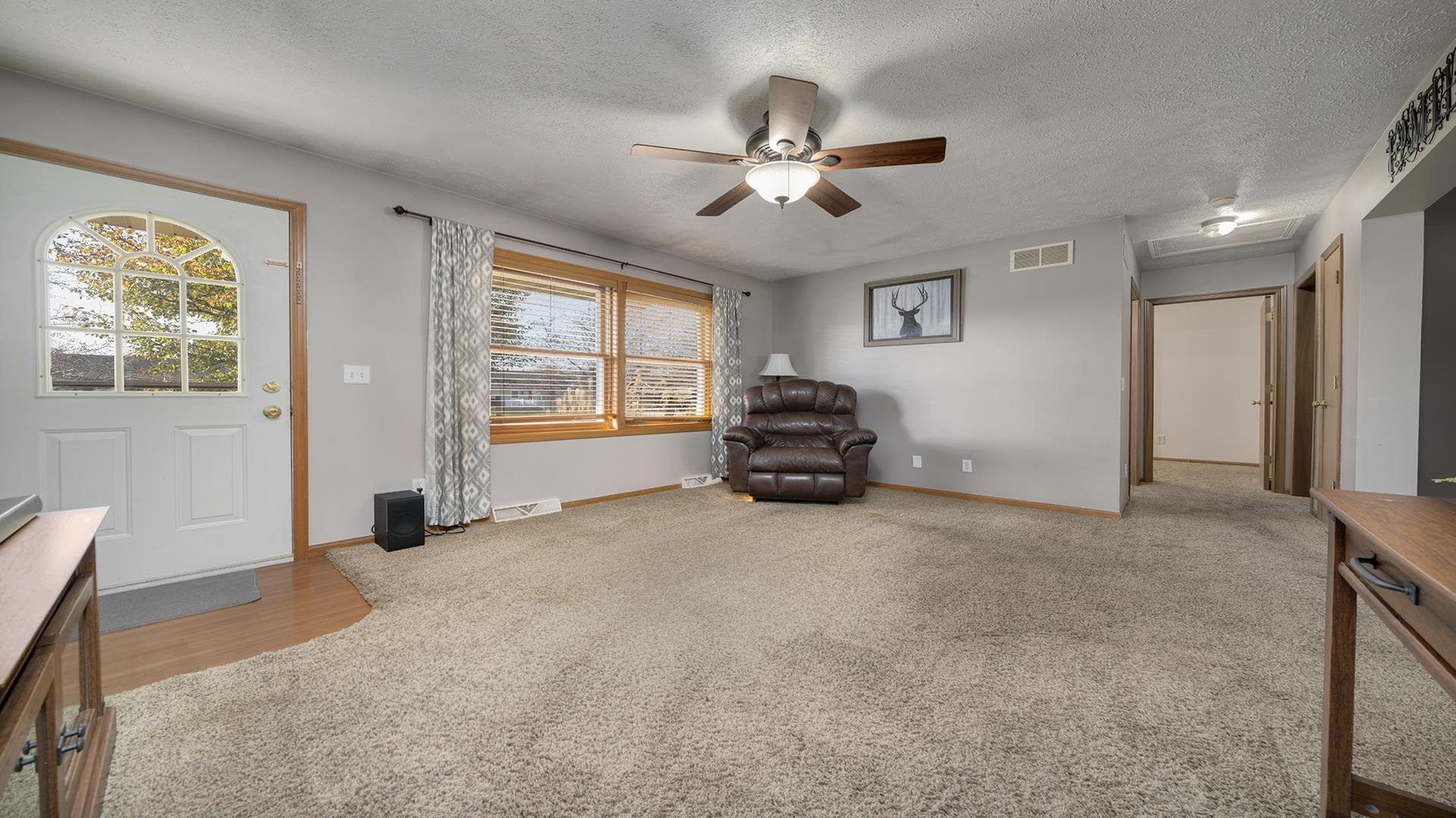6749 Friday Road Byron, IL 61010 - Photo 11 of 36 a view of a livingroom with furniture and windows