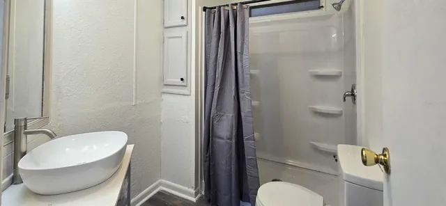 a bathroom with a toilet and a sink