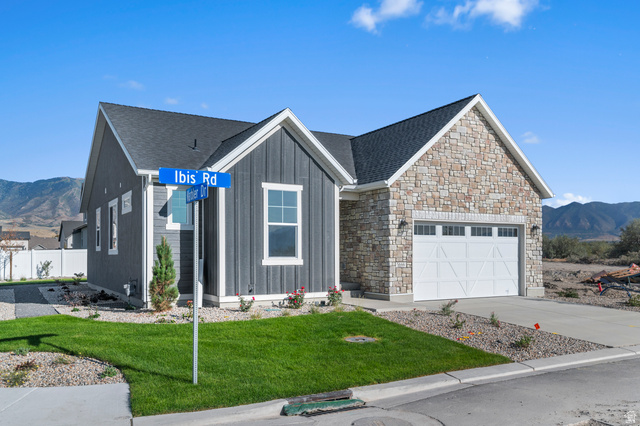 5644 Ibis Road Tooele, UT 84074 - Photo 2 of 19 Contemporary residence featuring a stone and board-and-batten exterior