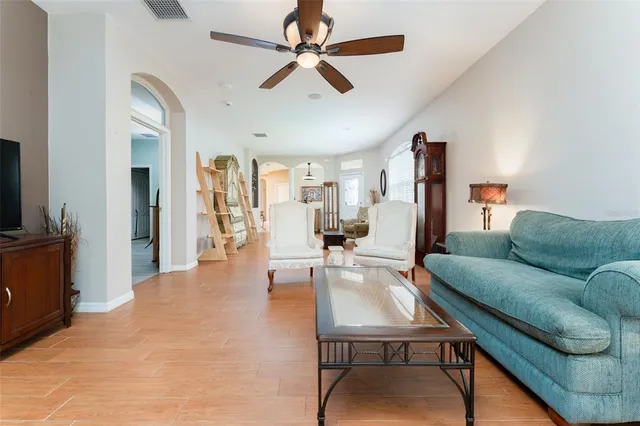 a bedroom with a bed next to a window