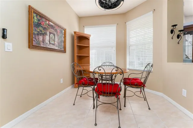 a kitchen with stainless steel appliances granite countertop a stove top oven a sink dishwasher a refrigerator and a microwave