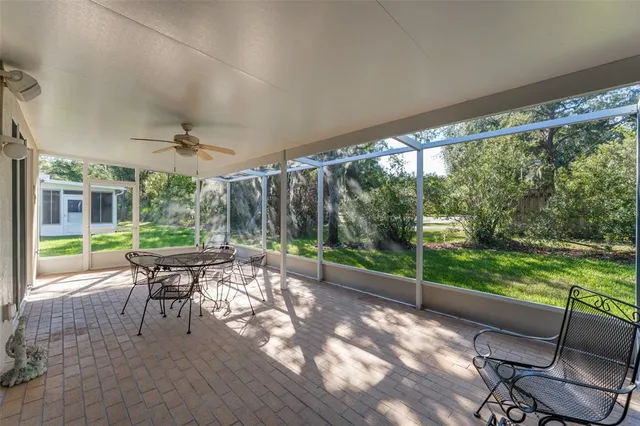 a view of a chairs and table in a backyard
