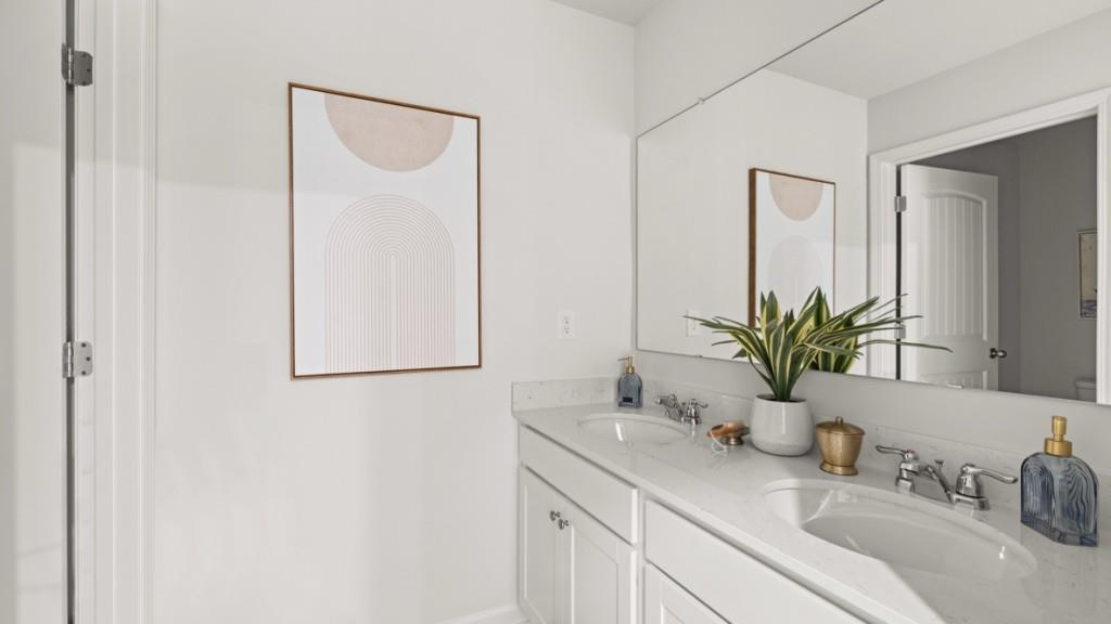 81 Buckthorn Way Dallas, GA 30132 - Photo 25 of 33 a bathroom with a sink and a mirror