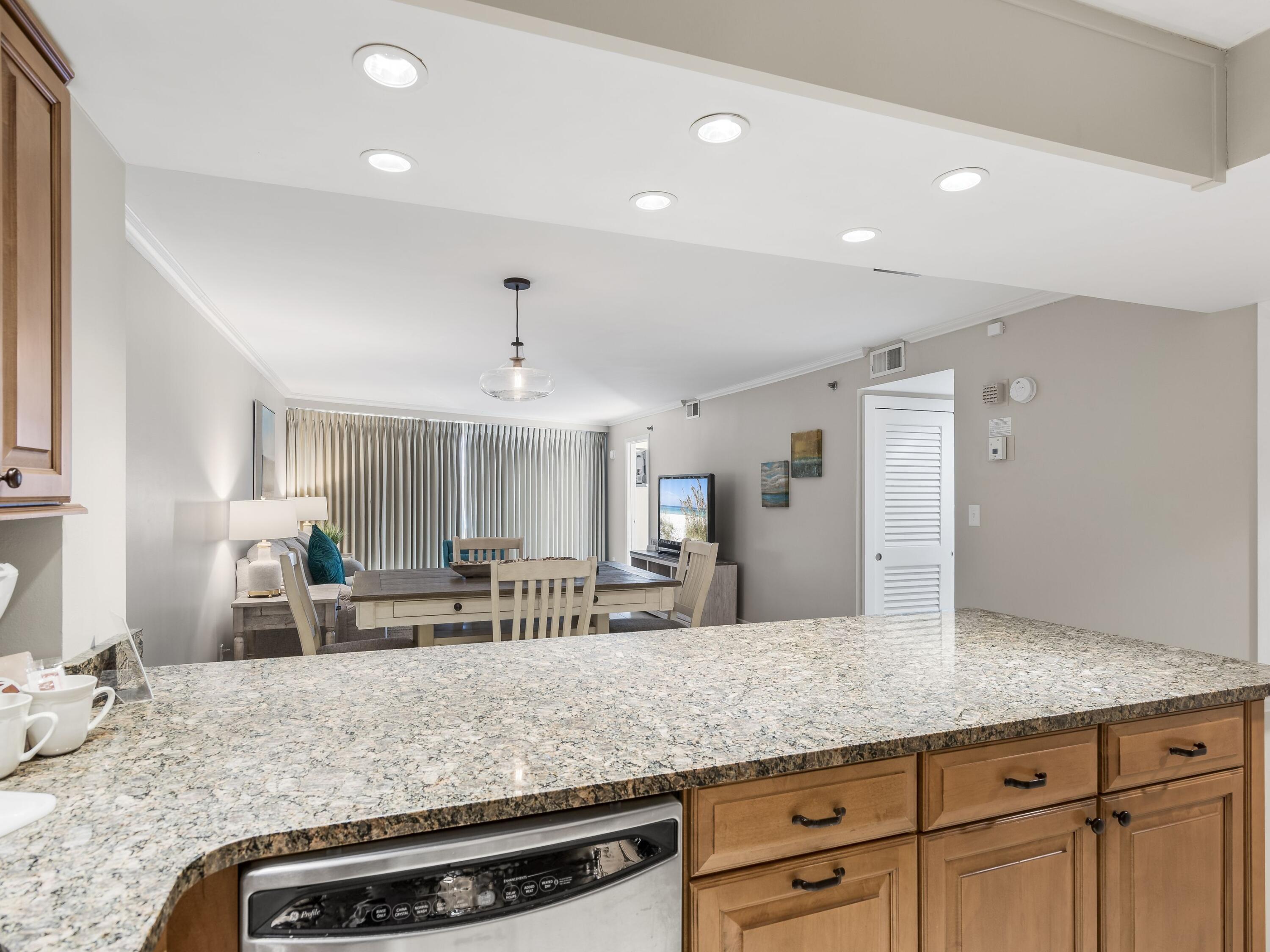 4218 Beachside 2, Unit 218 Miramar Beach, FL 32550 - Photo 11 of 29 a view of living room with granite countertop furniture and fireplace