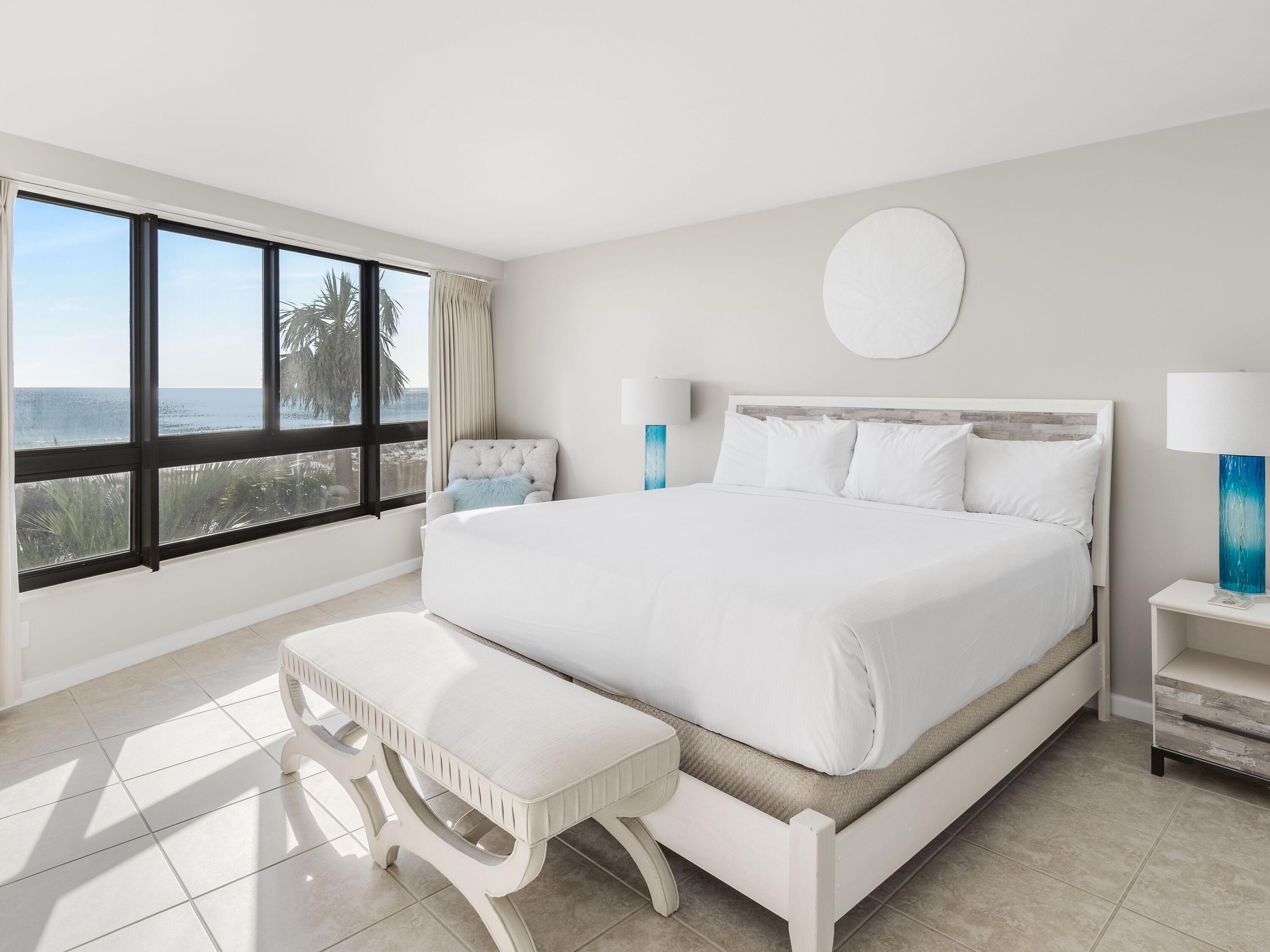 4218 Beachside 2, Unit 218 Miramar Beach, FL 32550 - Photo 12 of 29 a bed room with a bed and a large window