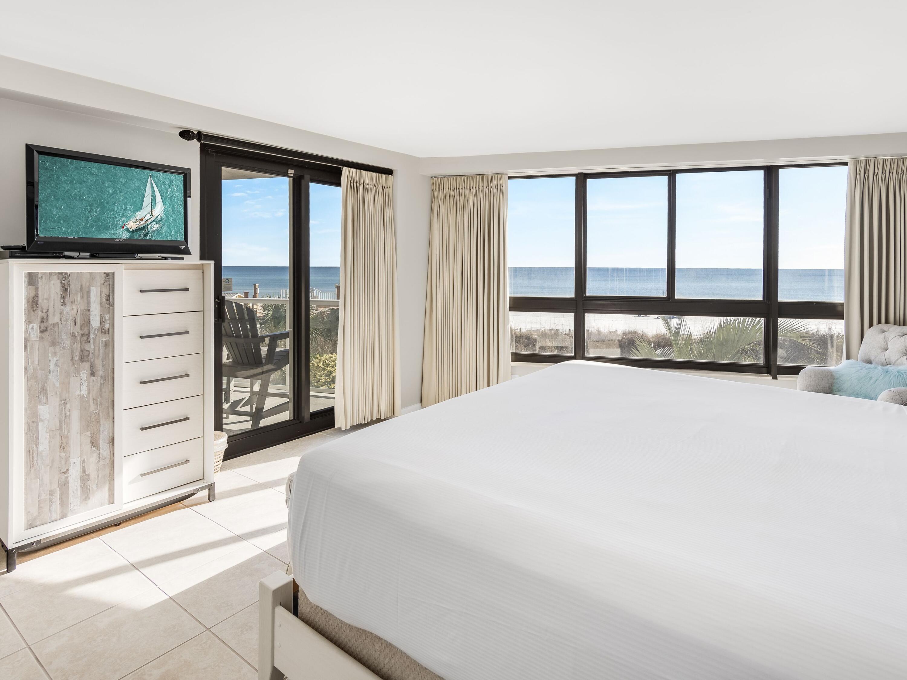 4218 Beachside 2, Unit 218 Miramar Beach, FL 32550 - Photo 13 of 29 a bedroom with a large bed and a large window