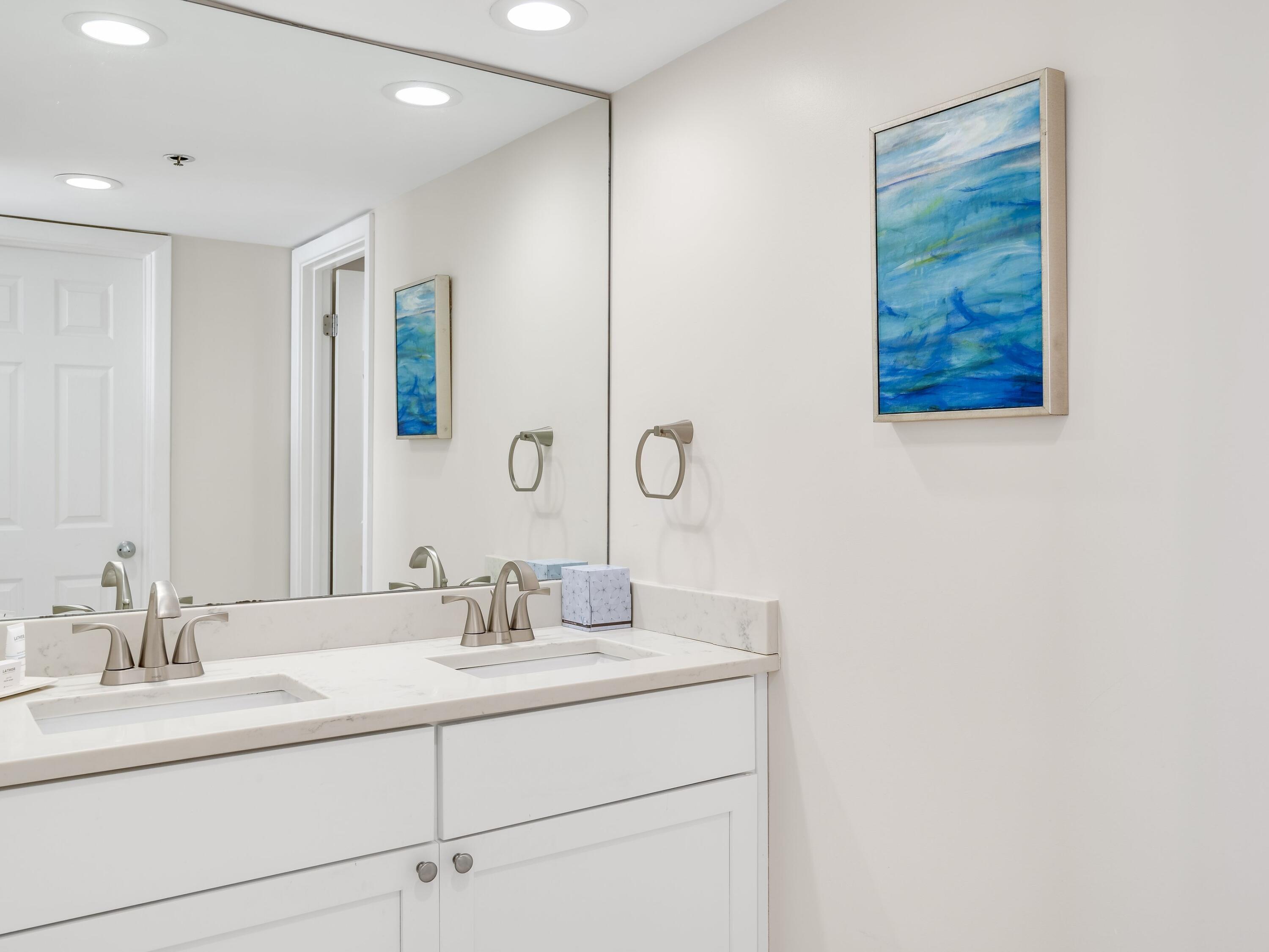 4218 Beachside 2, Unit 218 Miramar Beach, FL 32550 - Photo 15 of 29 a bathroom with a double vanity sink and a mirror