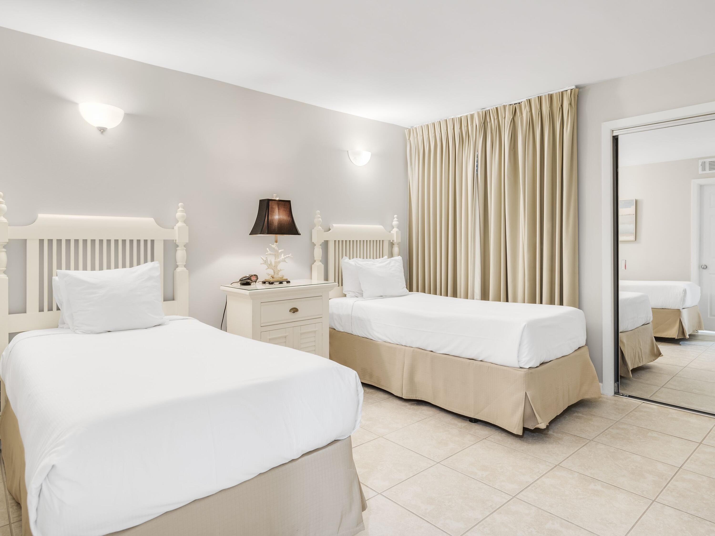 4218 Beachside 2, Unit 218 Miramar Beach, FL 32550 - Photo 17 of 29 a bedroom with two beds and a lamp