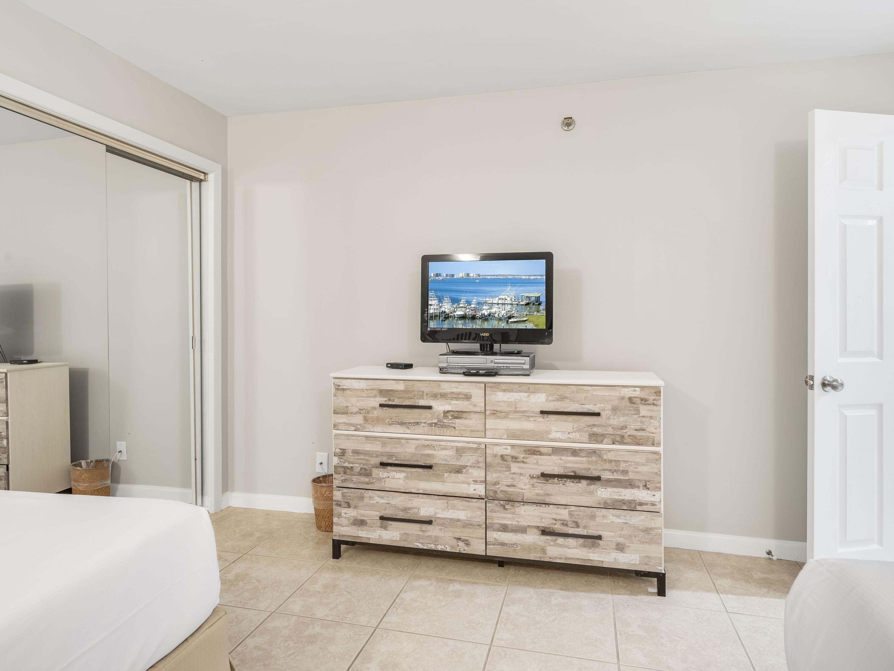 4218 Beachside 2, Unit 218 Miramar Beach, FL 32550 - Photo 18 of 29 a bedroom with a bed and a furniture