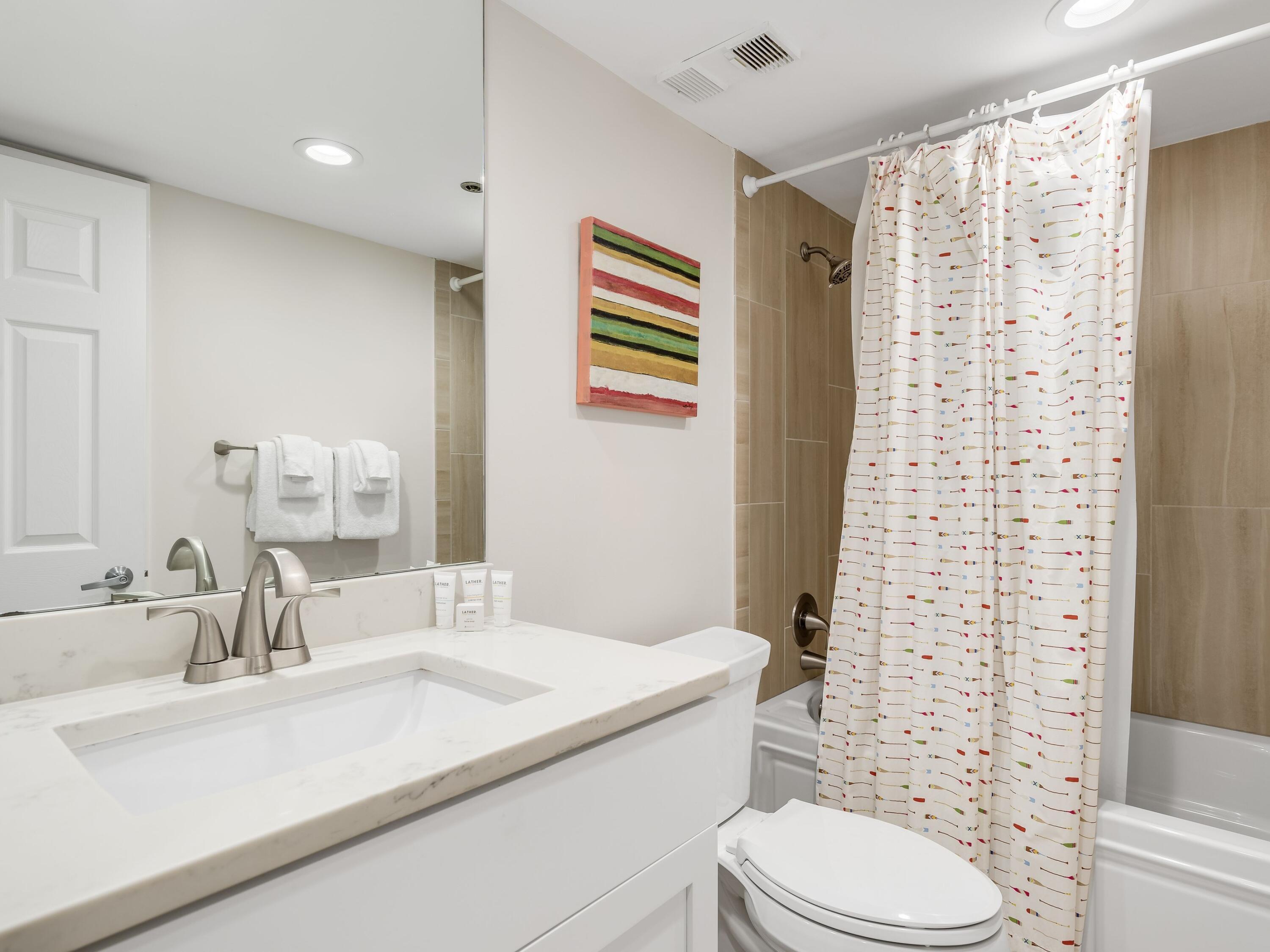 4218 Beachside 2, Unit 218 Miramar Beach, FL 32550 - Photo 20 of 29 a bathroom with a sink a toilet and shower