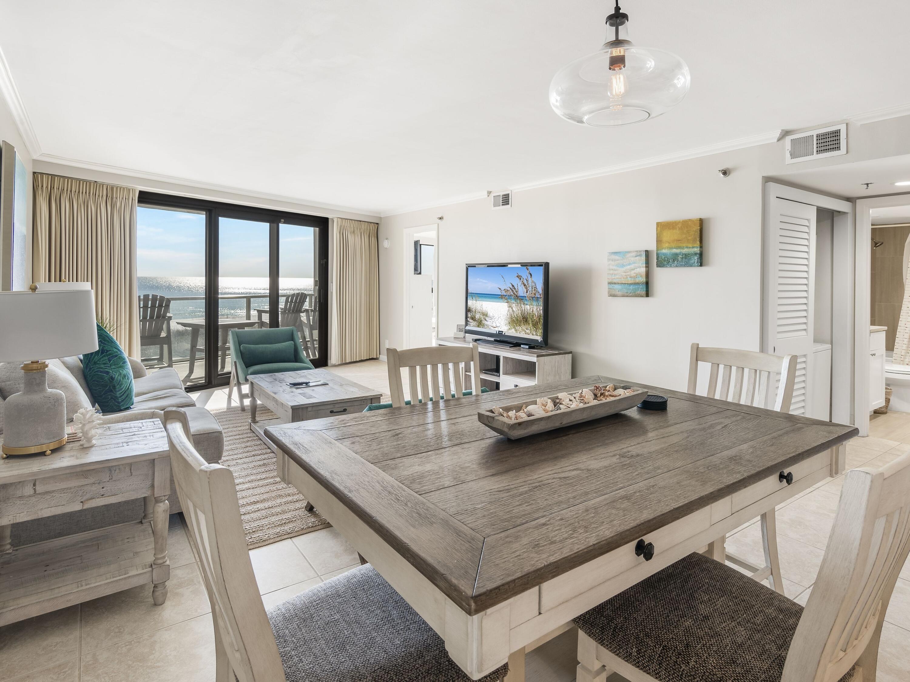 4218 Beachside 2, Unit 218 Miramar Beach, FL 32550 - Photo 4 of 29 a living room with furniture and a table