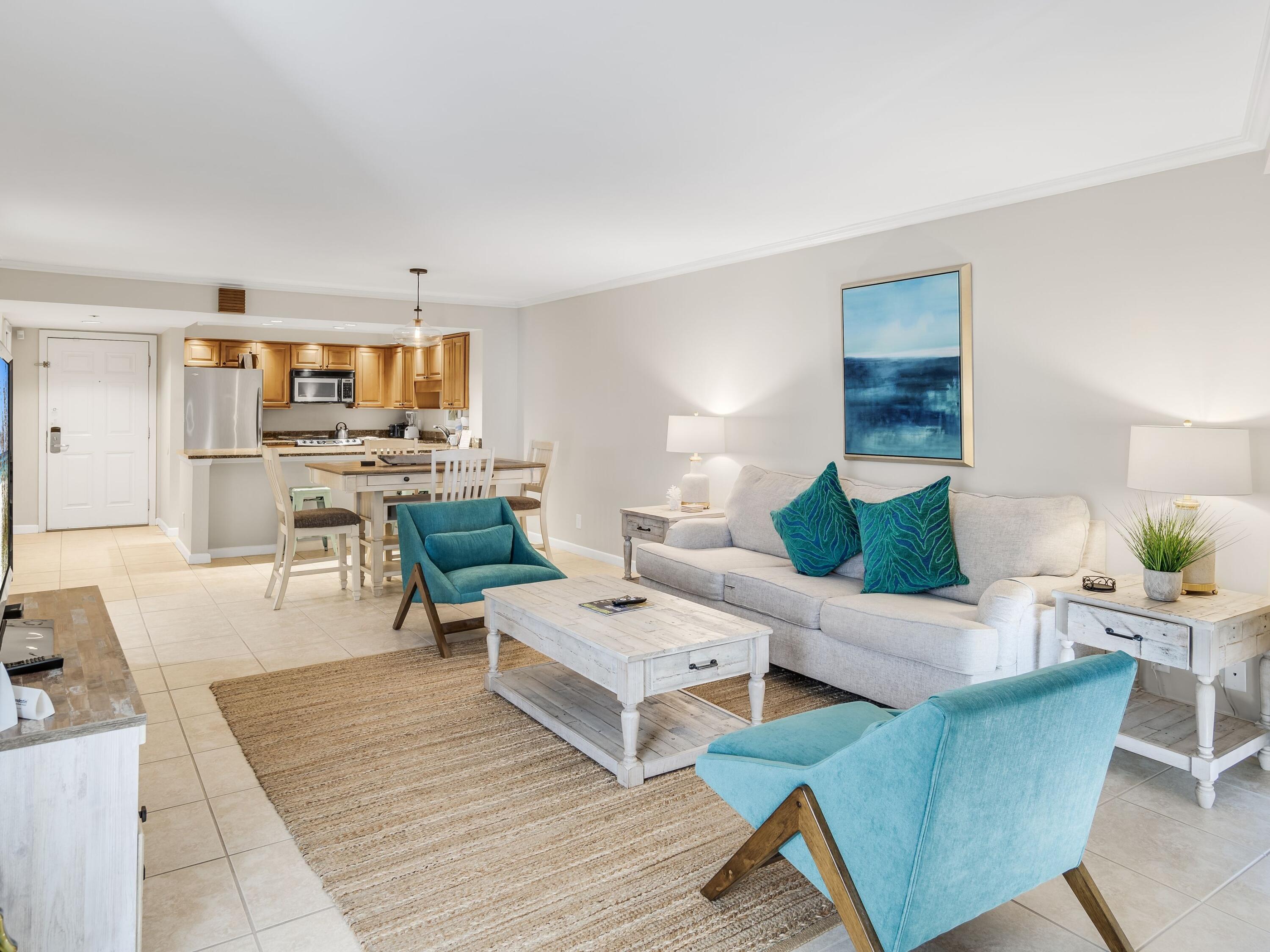 4218 Beachside 2, Unit 218 Miramar Beach, FL 32550 - Photo 29 of 29 a living room with furniture and a wooden floor