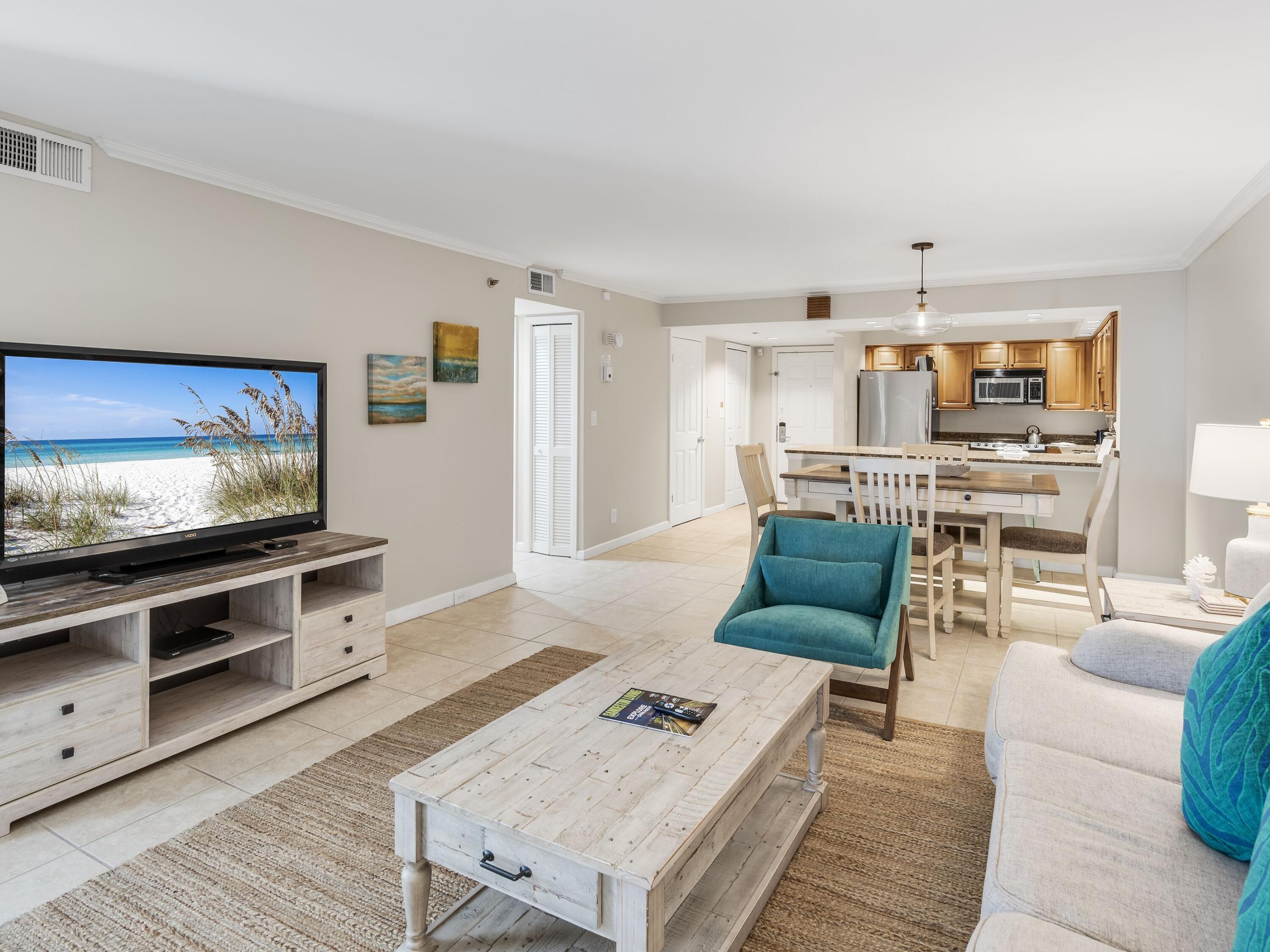 4218 Beachside 2, Unit 218 Miramar Beach, FL 32550 - Photo 6 of 29 a living room with furniture and a flat screen tv