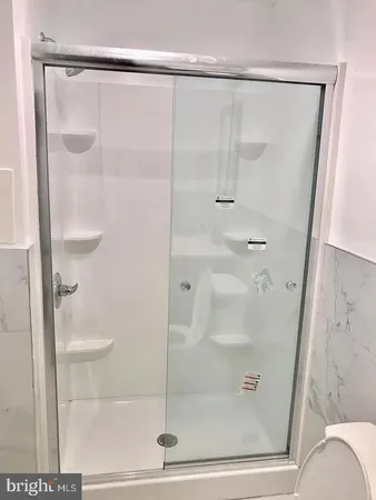 a kitchen with stainless steel appliances a sink a stove and a microwave