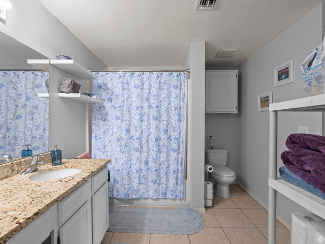 900 Bitner Road, Unit D 34 Park City, UT 84098 - Photo 15 of 25 Bathroom featuring vanity, a shower with curtain, and light tile patterned floors
