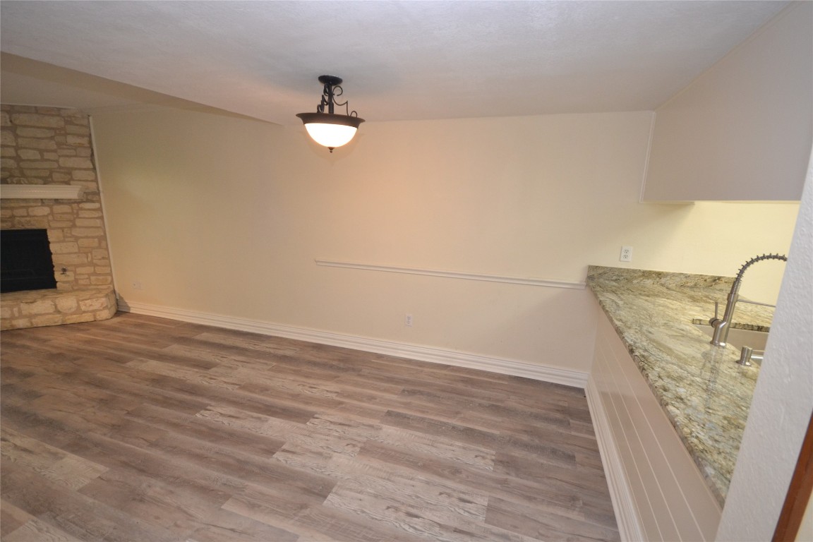 500 Hesters Crossing Road, Unit 205 Round Rock, TX 78681 - Photo 2 of 18 a view of a livingroom with wooden floor