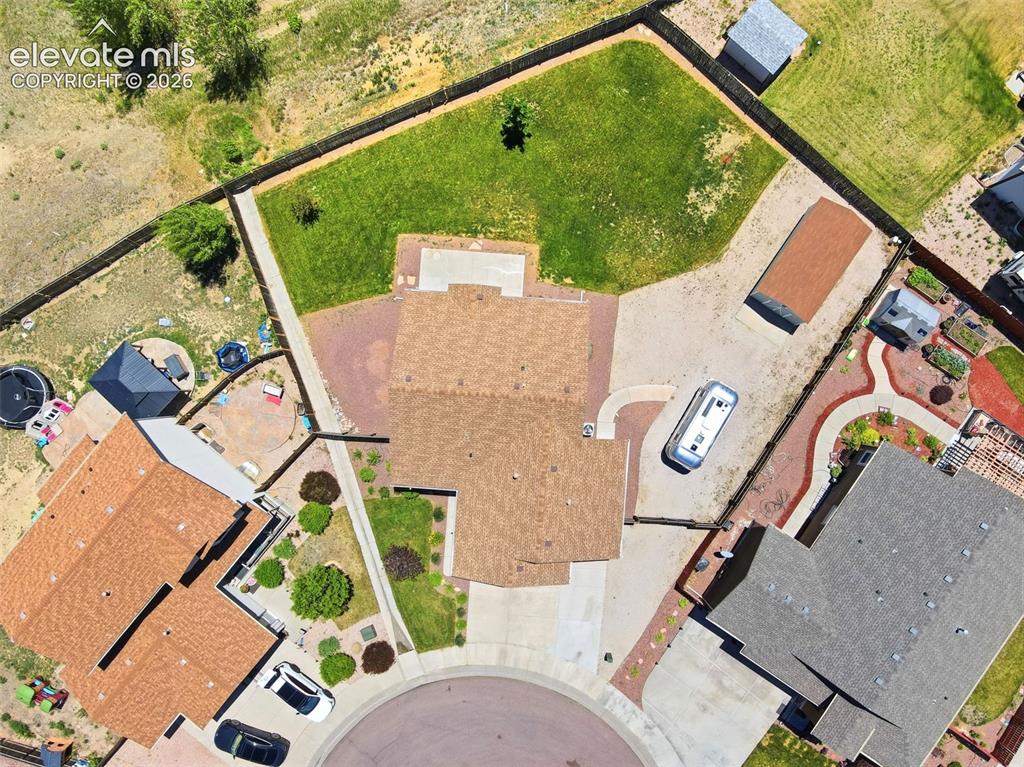 7806 Dutch Loop Colorado Springs, CO 80925 - Photo 41 of 41 an aerial view of a house with a yard and pool