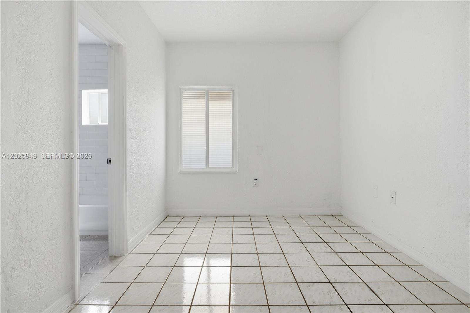 1745 Southwest 17th Street, Unit 2 Miami, FL 33145 - Photo 19 of 32 a view of an empty room and window