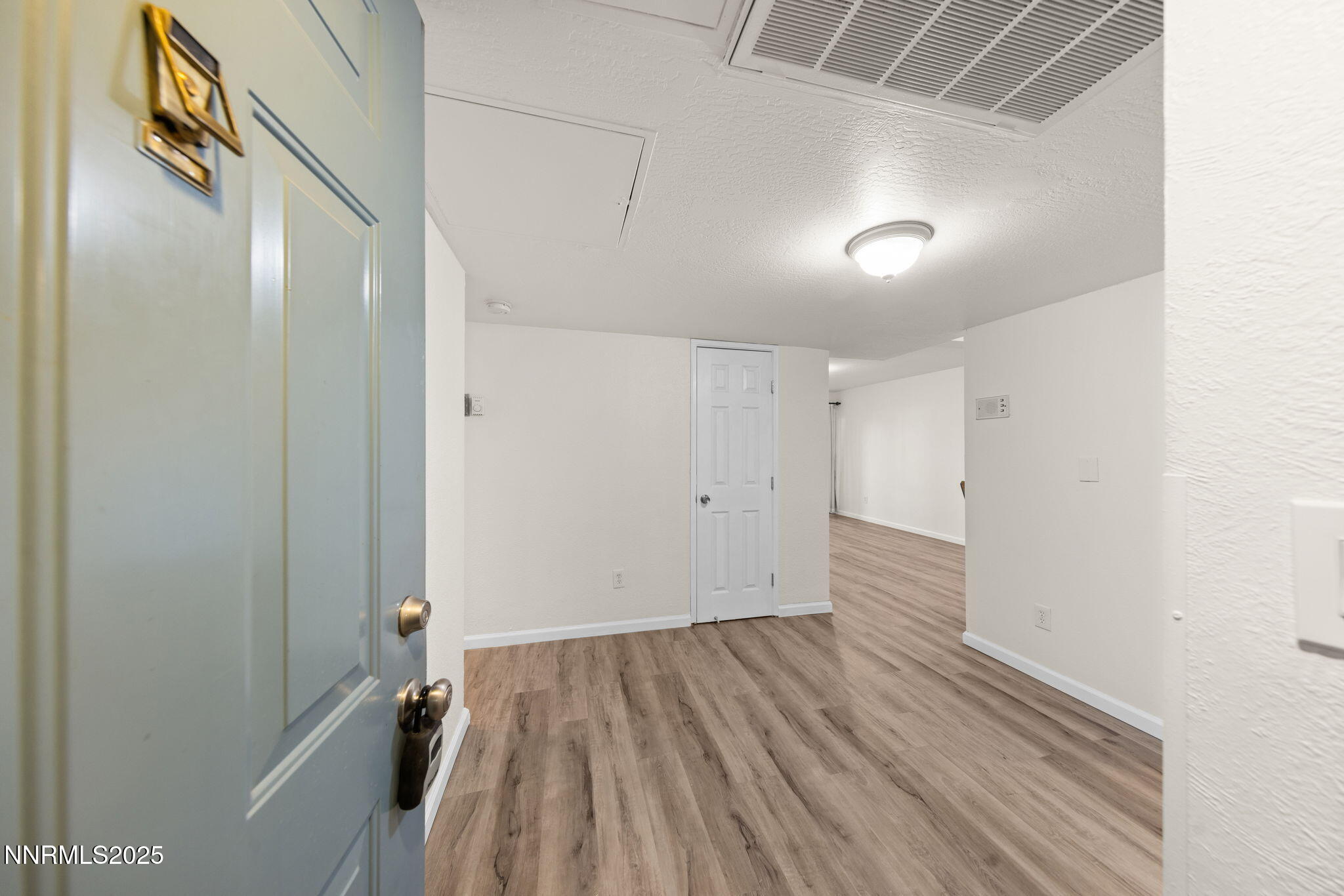 2555 Clear Acre Lane, Unit 161 Reno, NV 89512 - Photo 1 of 17 a view of hallway with wooden floor