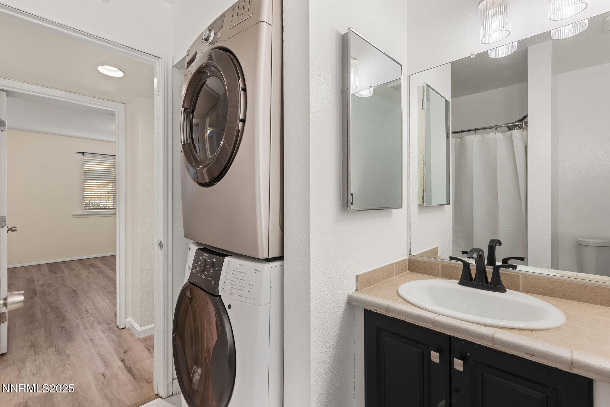 2555 Clear Acre Lane, Unit 161 Reno, NV 89512 - Photo 12 of 17 a bathroom with a sink and a mirror