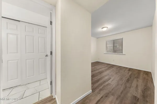 a view of a hallway with closet