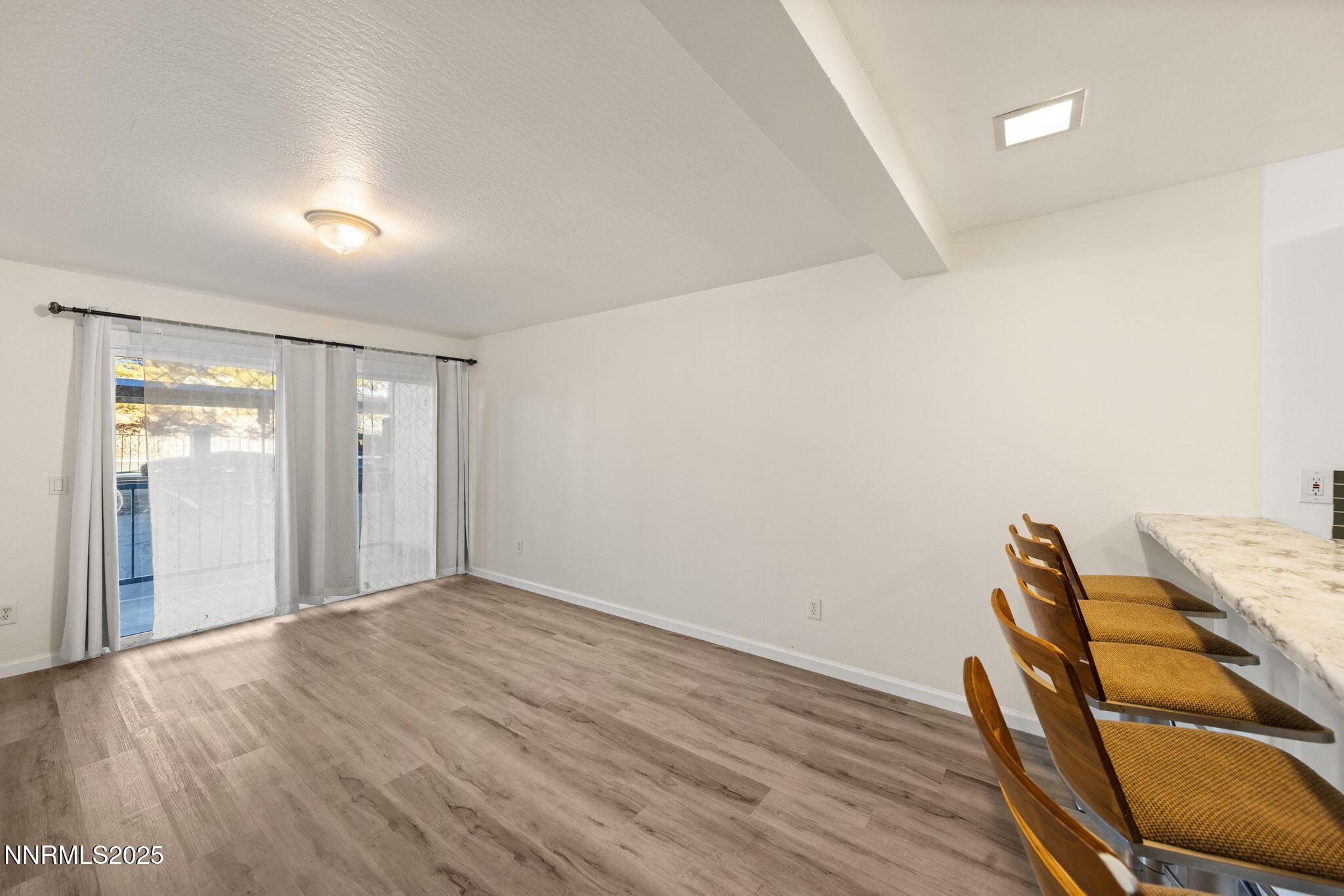 2555 Clear Acre Lane, Unit 161 Reno, NV 89512 - Photo 5 of 17 a view of a room with wooden floor and furniture