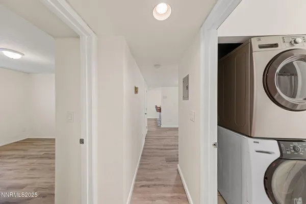 a view of a hallway with washer and dryer