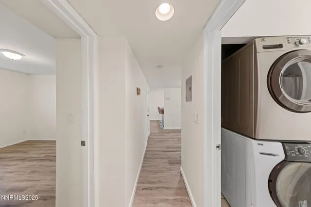 a view of a hallway with washer and dryer