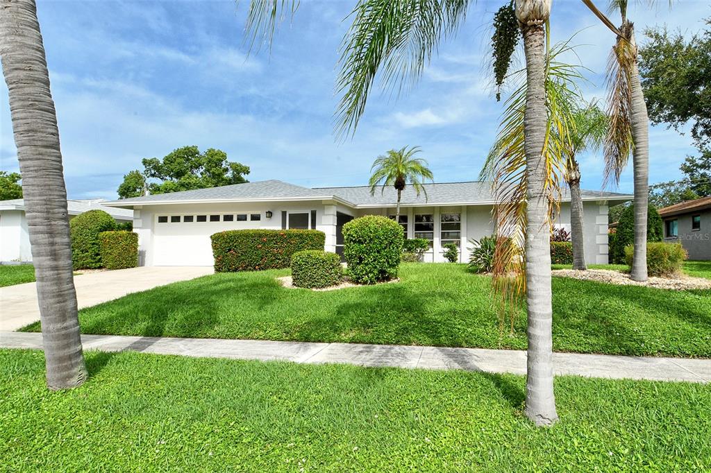 6722 Roxbury Drive Sarasota, FL 34231 - Photo 2 of 87 a front view of a house with a yard
