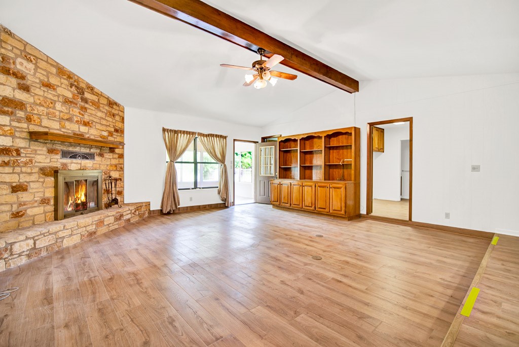 298 Jenkins Road Cedar Creek, TX 78612 - Photo 11 of 40 a view of an empty room with wooden floor and a window
