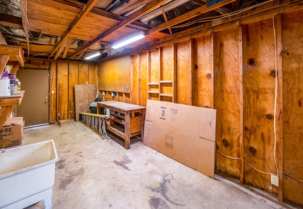 298 Jenkins Road Cedar Creek, TX 78612 - Photo 26 of 40 Workshop space is an extension of the two car attached garage.