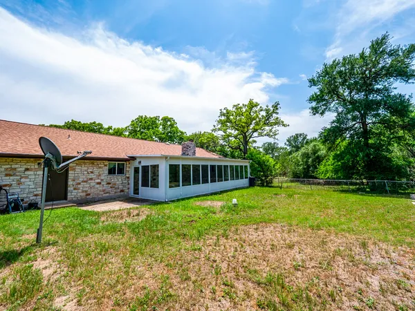 a view of backyard with green space