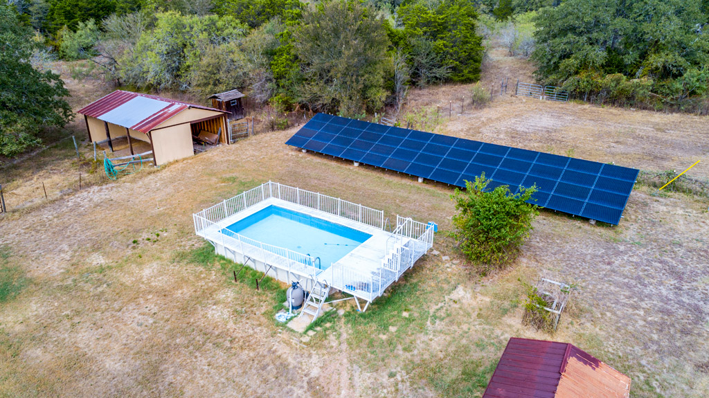 298 Jenkins Road Cedar Creek, TX 78612 - Photo 30 of 40 Small barn in the back has recently been reworked, cool off in the pool and enjoy lower electric bills from these 52 solar panels.