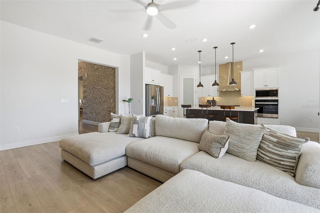16131 Volterra Point Bella Collina, FL 34756 - Photo 19 of 52 a living room with furniture and a view of kitchen