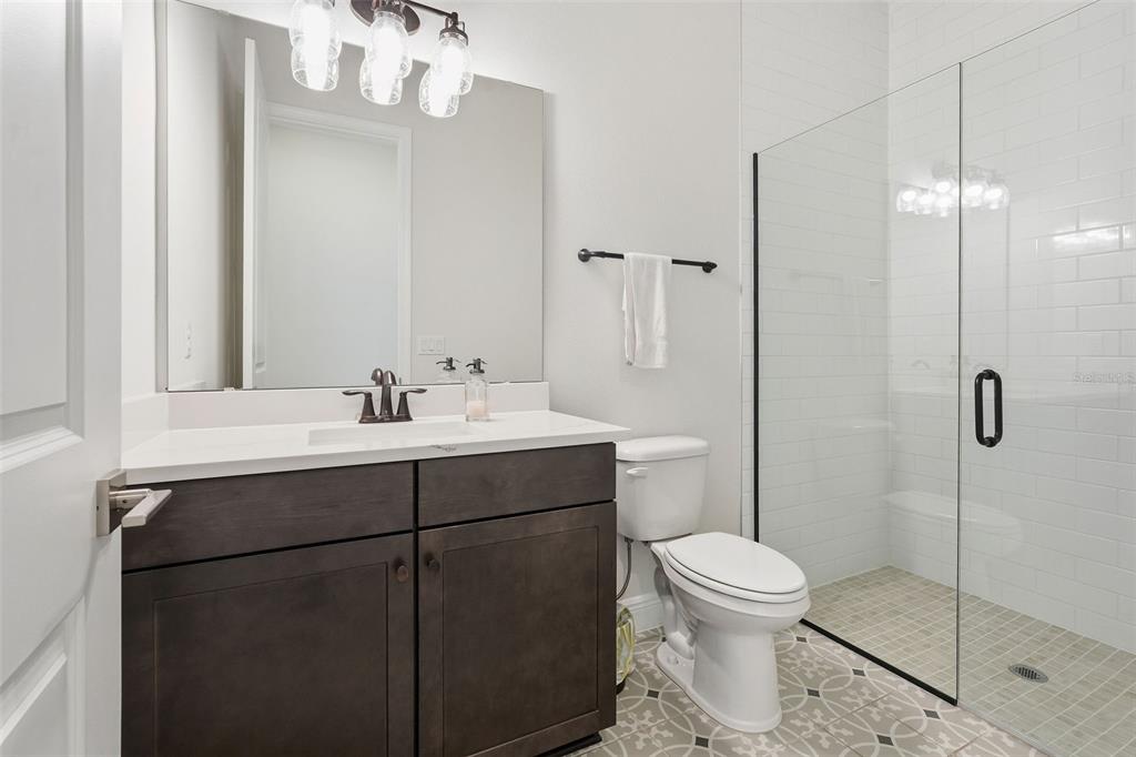 16131 Volterra Point Bella Collina, FL 34756 - Photo 26 of 52 a bathroom with a sink toilet and shower