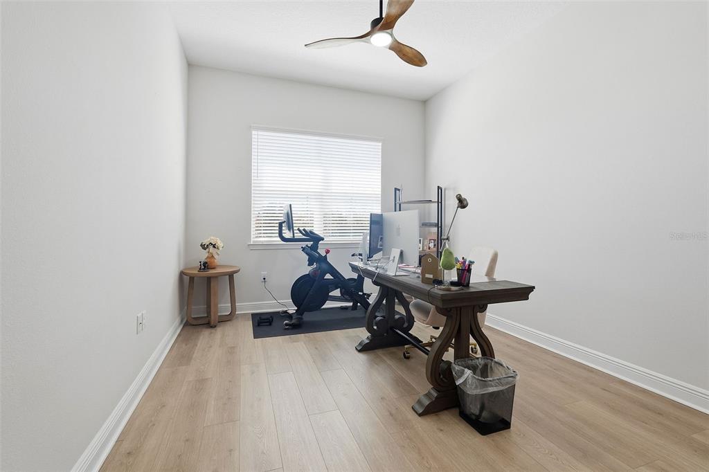 16131 Volterra Point Bella Collina, FL 34756 - Photo 29 of 52 a living room with furniture and a wooden floor