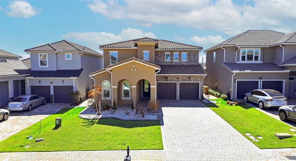 16131 Volterra Point Bella Collina, FL 34756 - Photo 3 of 52 a front view of a house with garden