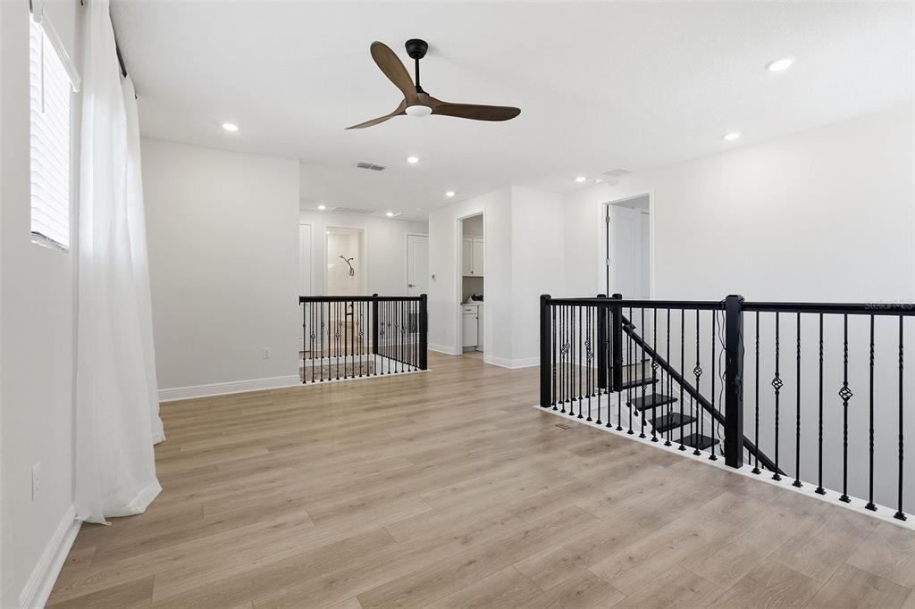 16131 Volterra Point Bella Collina, FL 34756 - Photo 33 of 52 a view of a hallway with wooden floor