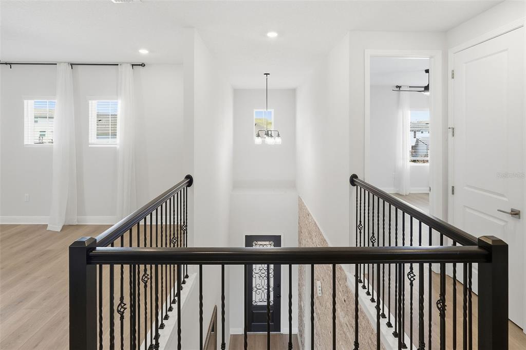 16131 Volterra Point Bella Collina, FL 34756 - Photo 35 of 52 a view of staircase with railing and a window