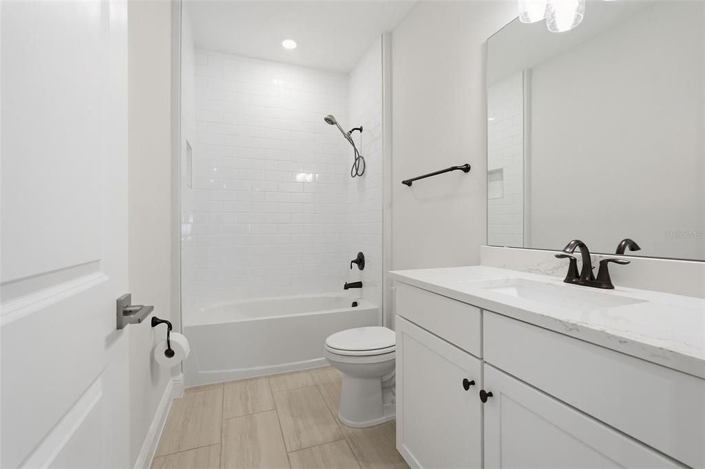 16131 Volterra Point Bella Collina, FL 34756 - Photo 36 of 52 a bathroom with a sink a toilet and shower