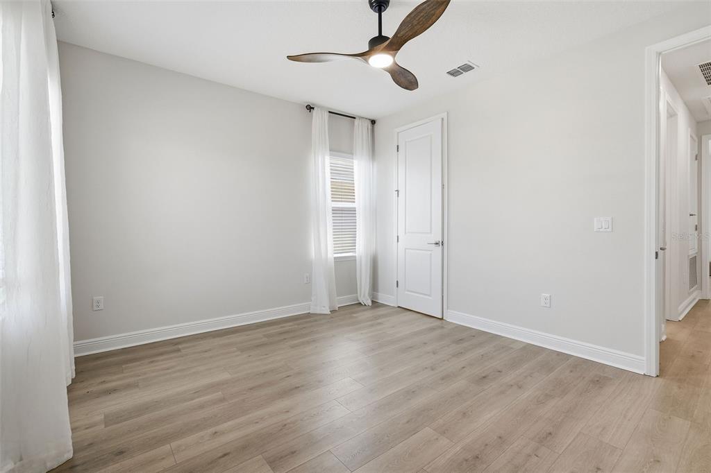 16131 Volterra Point Bella Collina, FL 34756 - Photo 38 of 52 a view of an empty room with wooden floor