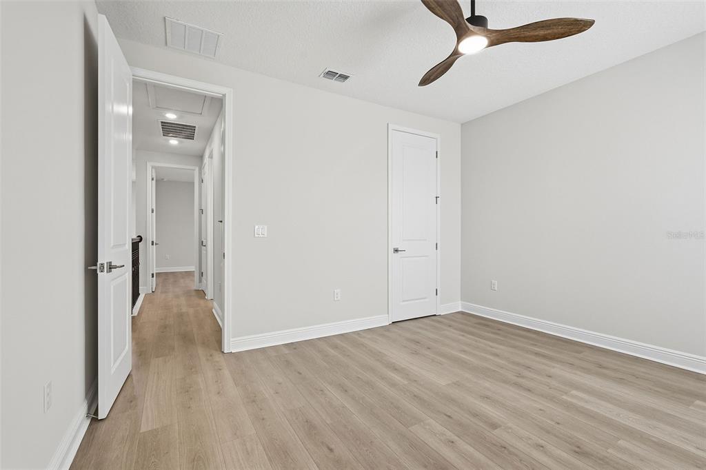 16131 Volterra Point Bella Collina, FL 34756 - Photo 40 of 52 a view of an empty room with wooden floor