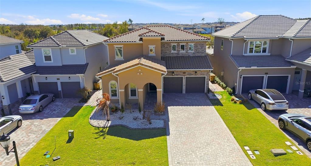 16131 Volterra Point Bella Collina, FL 34756 - Photo 4 of 52 an aerial view of a house with swimming pool